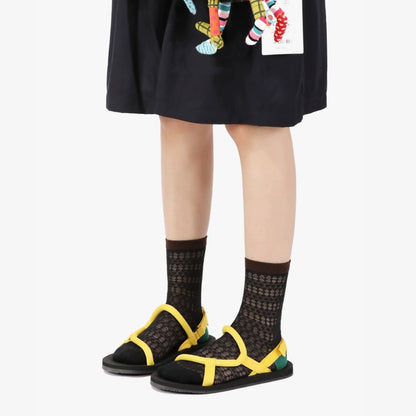 Model wearing a pair of black cotton socks, easy for travel days and daily comfort.