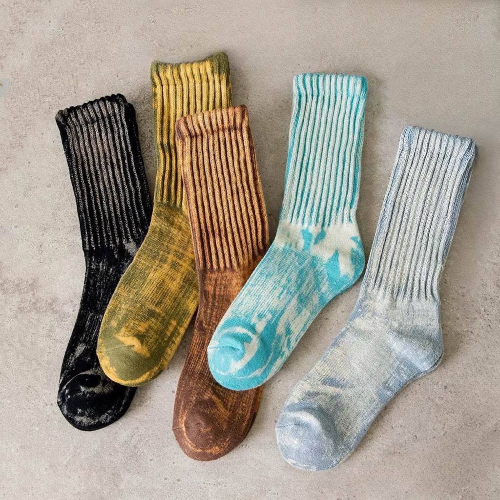 Front view of Five pairs of cotton-polyester metallic tie-dye slouch socks in black, aqua, tan, blue, and grey.