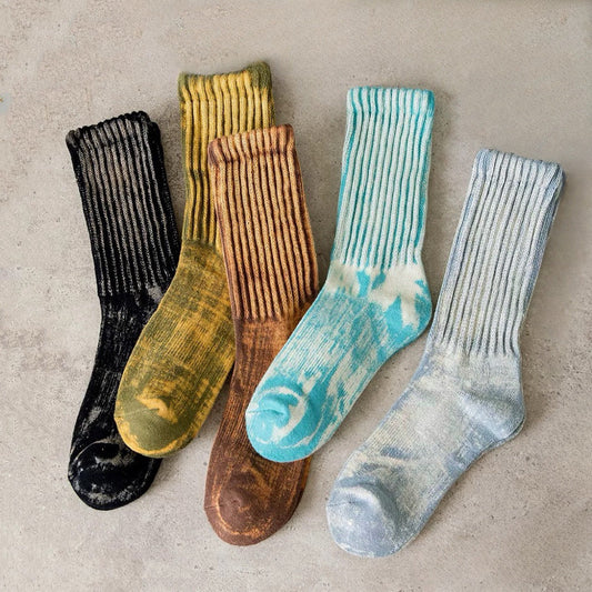 Front view of Five pairs of cotton-polyester metallic tie-dye slouch socks in black, aqua, tan, blue, and grey.