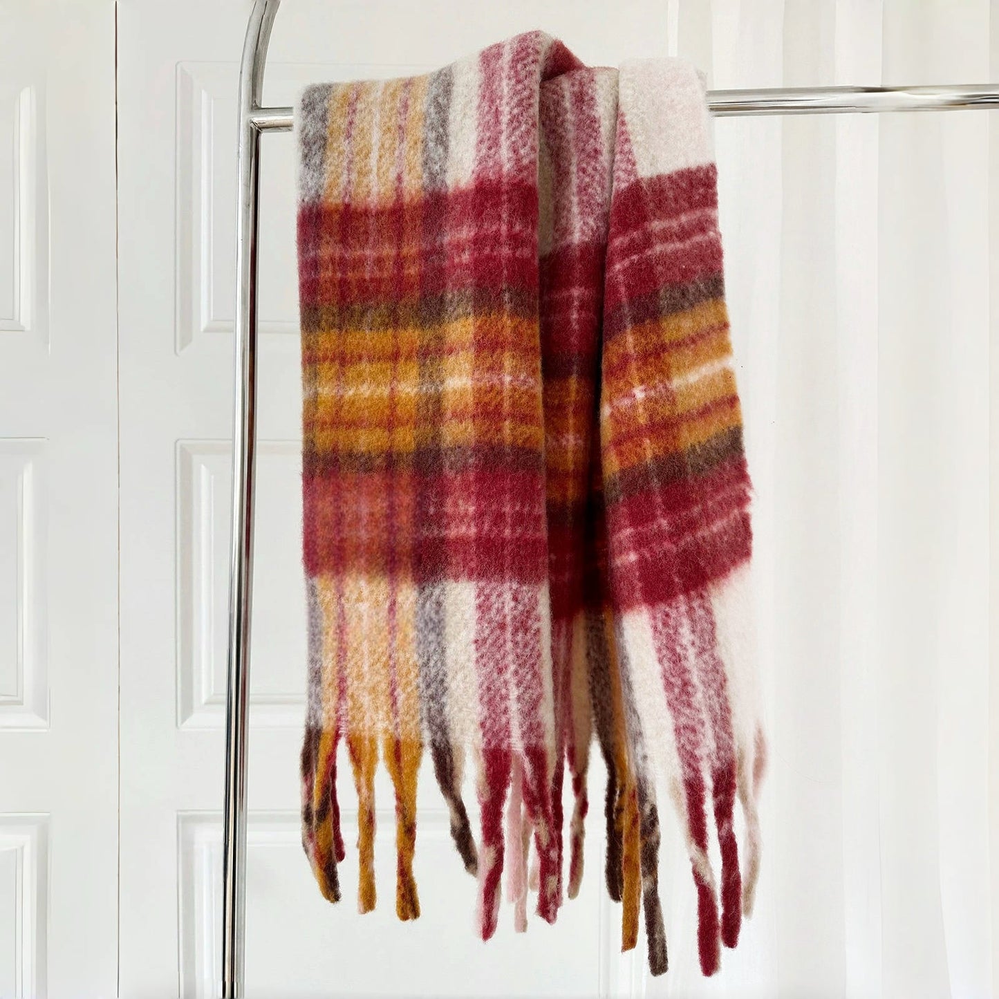 Flat lay of Autumn Ember Plaid Scarf in burgundy and maroon and red, ideal for everyday styling and weekend outings.