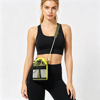 Woman in black activewear with a sporty mini bucket crossbody bag, featuring braided rope strap and mesh