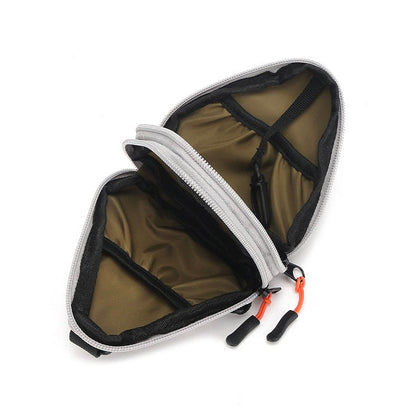 The interior of the mini triangle nylon pouch featuring two slip pockets and a built-in key hook.