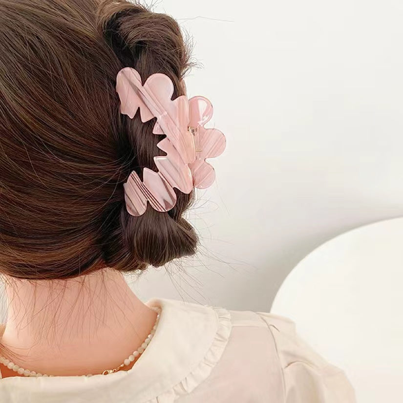 Model wearing Moon Hair Claw in pink, easy for workdays and special occasions.