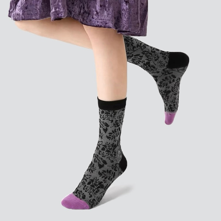 Model wearing a pair of Mystic Floral Socks.