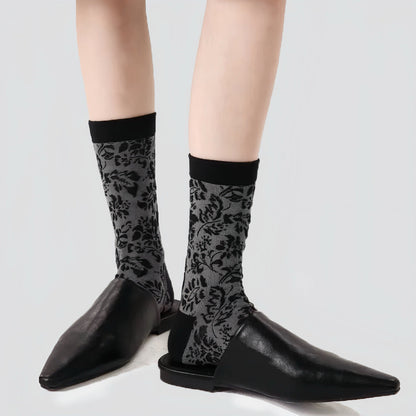 Flat lay of Mystic Floral Socks in black socks, great for daily wear and lounging.
