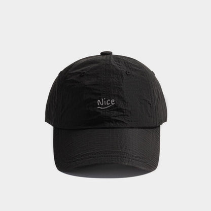 Front flat view of the versatile black quick dry running cap for timeless techwear and outdoor gear