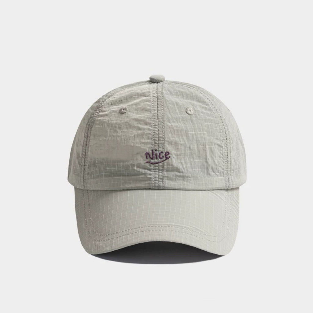 Front flat view of the light grey quick dry cap, an essential piece of lightweight outdoor gear.