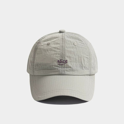 Front flat view of the light grey quick dry cap, an essential piece of lightweight outdoor gear.