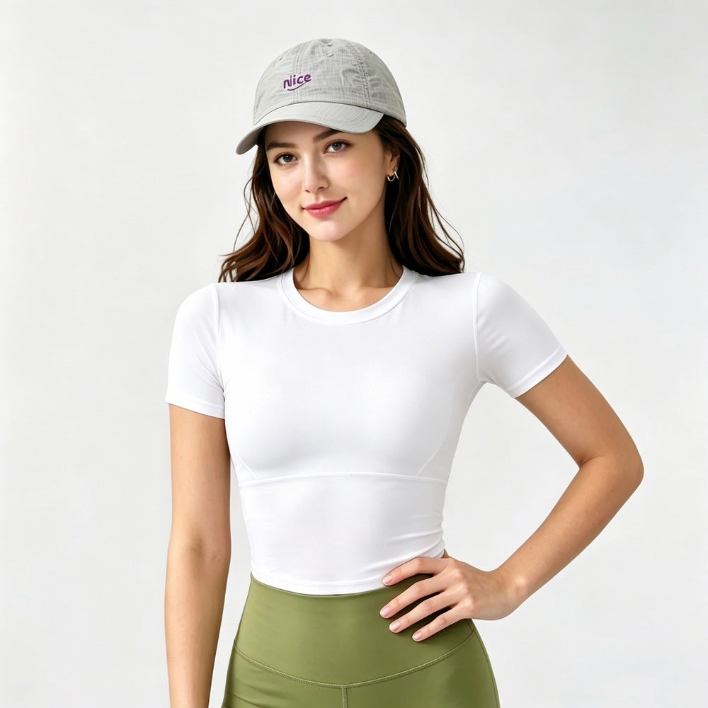 Model posing in a light grey performance cap, perfect accent for a gorpcore aesthetic look.