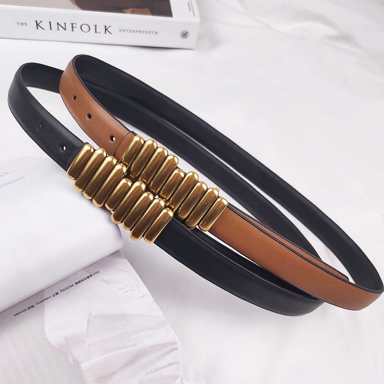 Two PU leather belts, one black and one brown , with unique gold bar buckle.