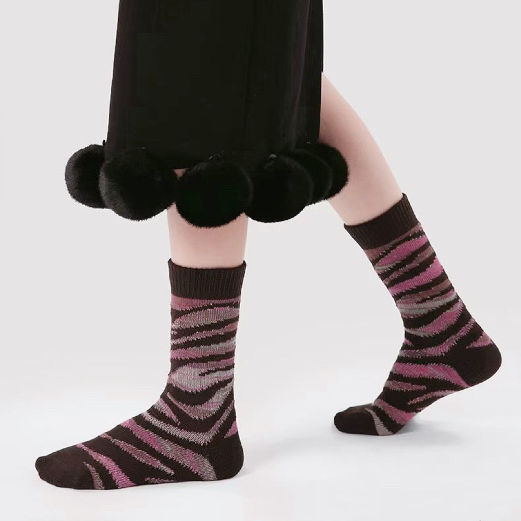Model wearing a pair of pink cotton crew socks, great for casual wear and light workouts.