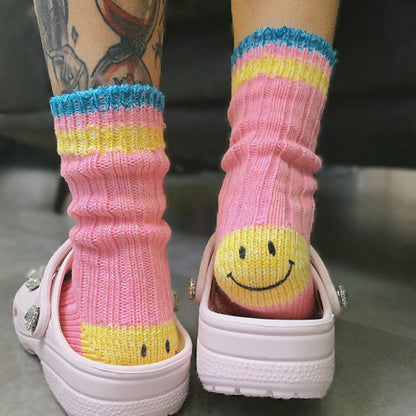 Pink striped socks featuring a hidden smile for a playful, unique look