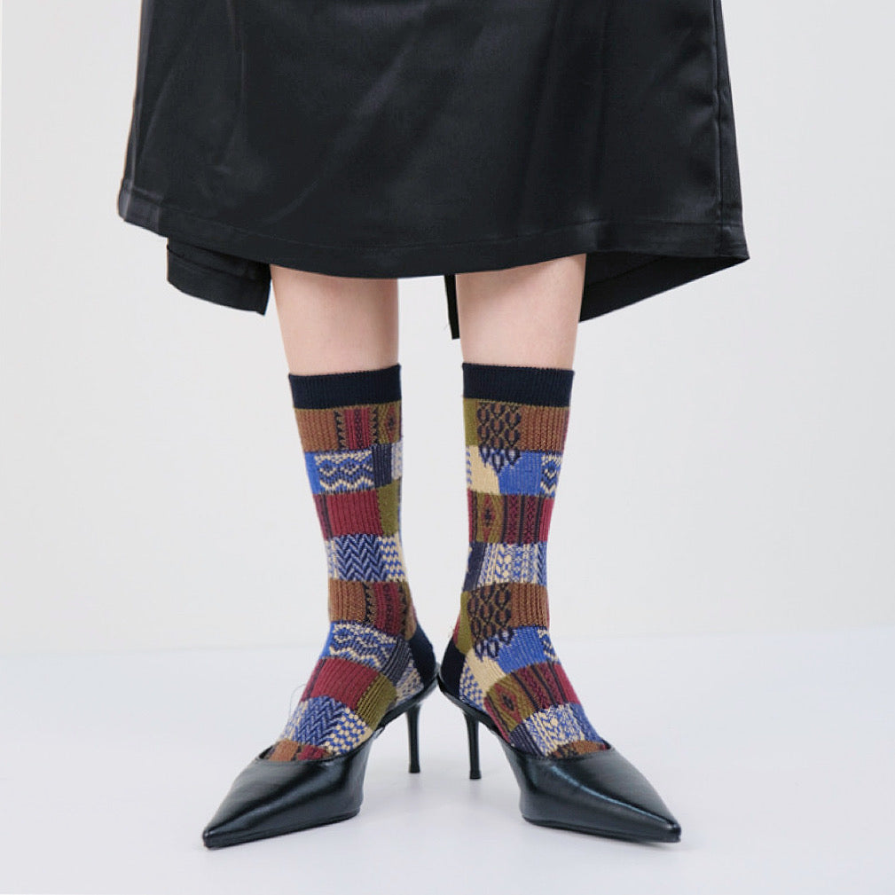 Model wearing a pair of Plaid Patchwork Socks, great for casual wear and light workouts.