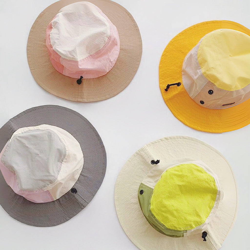 Four variations of the plant-inspired brimmed hat in earth tones and vibrant yellows.