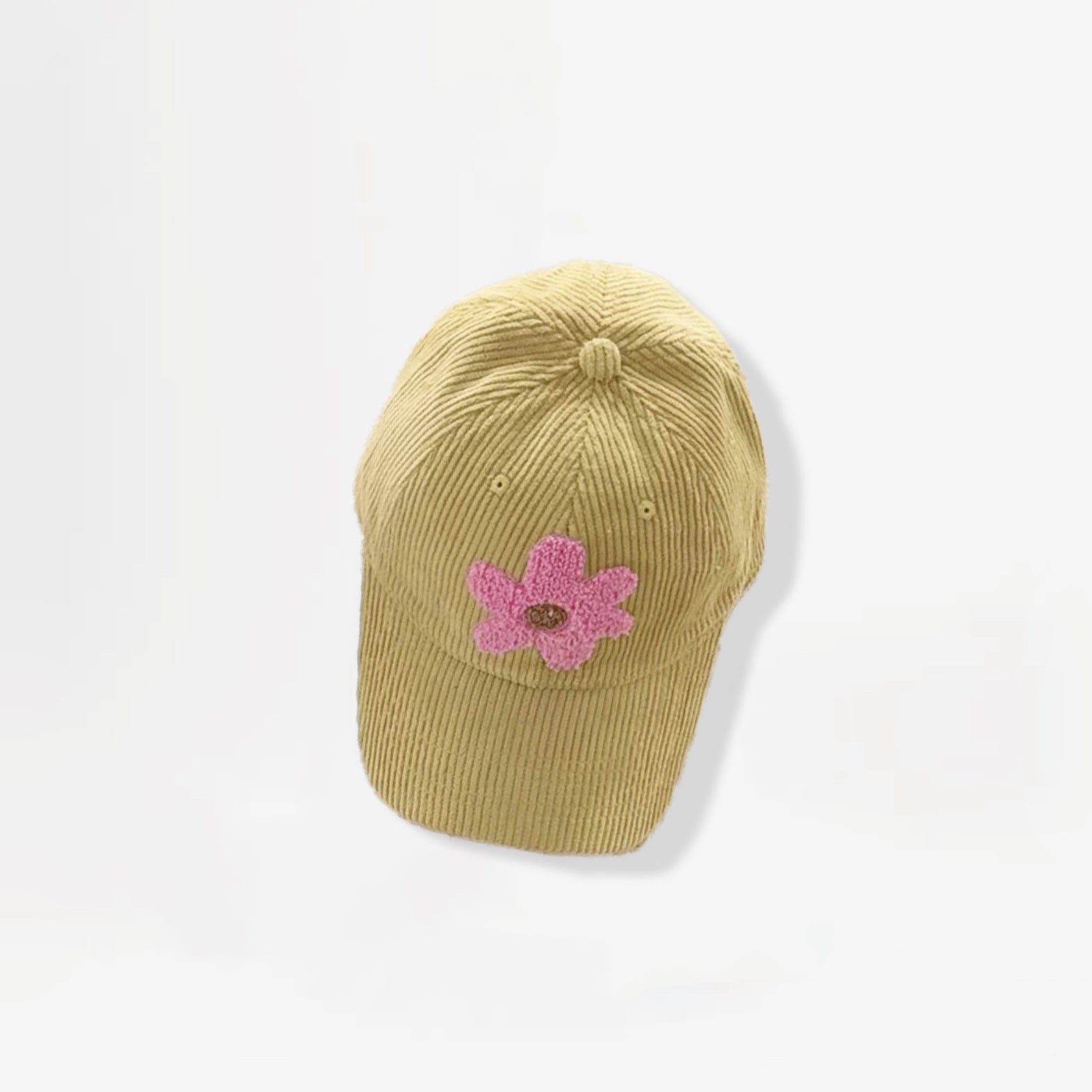 Mustard corduroy baseball cap featuring a pink plush flower embroidery.