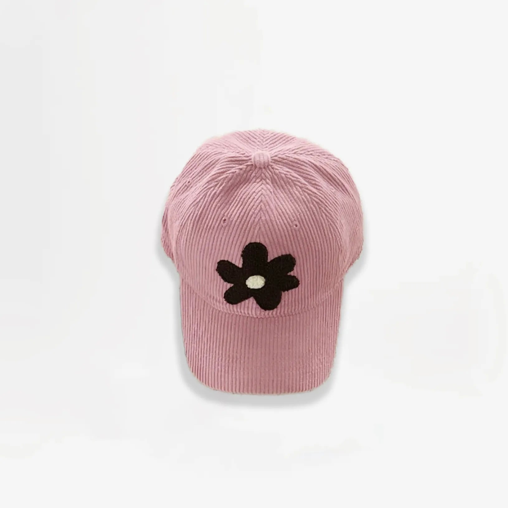 Pink corduroy baseball cap featuring a brown plush flower embroidery.