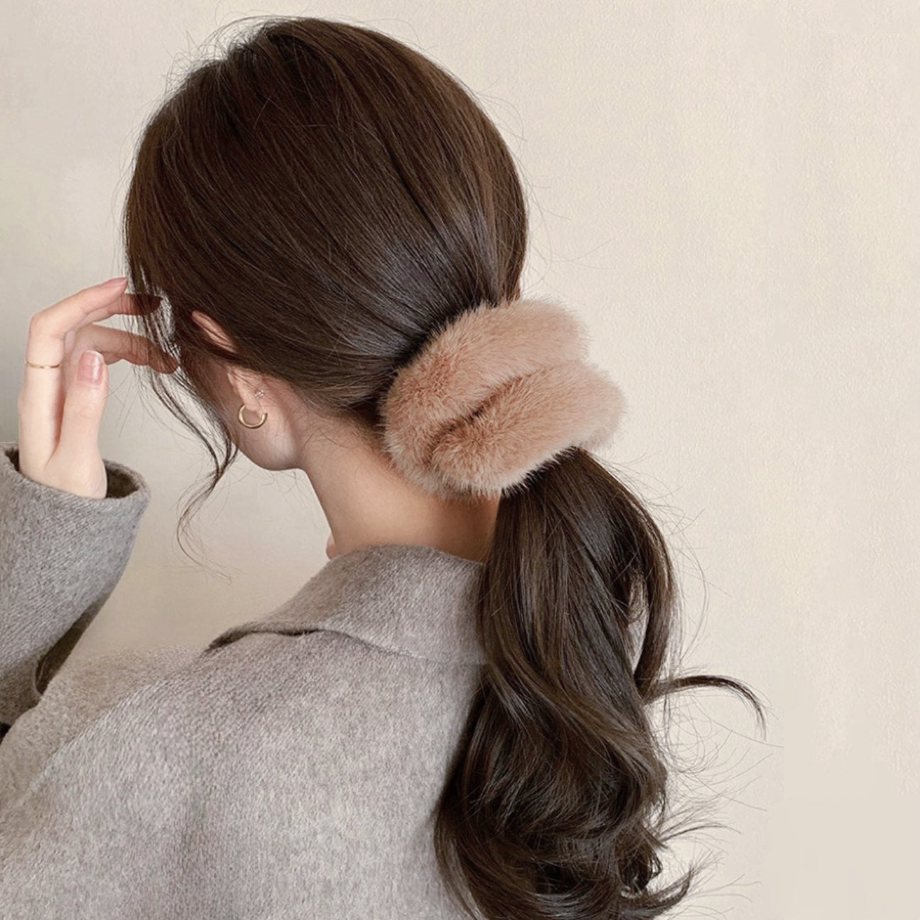 Model wearing Plush Scrunchie in tan, easy for workdays and special occasions.