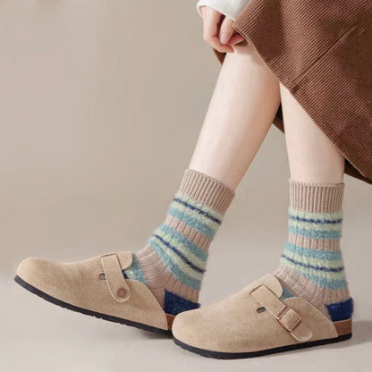 Model wearing a pair of Plush Striped Socks in khaki, ideal for workouts and commuting.