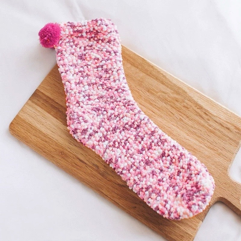 Folded view of Pompom Cupcake Socks in pink, great for daily wear and lounging.