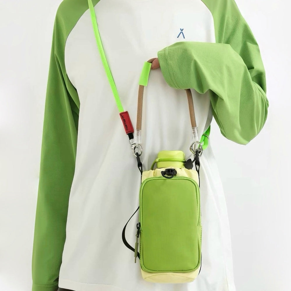 Model wearing a lime green sweatshirt displaying the vibrant green utility bottle carrier across the chest.