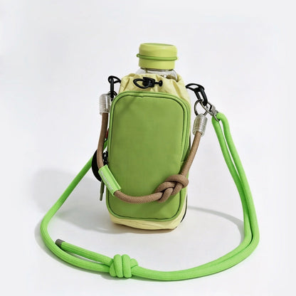 Studio flat lay of the lime green utility bottle carrier holding a matching green water bottle with a thick neon shoulder cord.