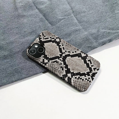 Realistic python skin motif on a durable silicone iPhone case. High-fashion animal print accessory.