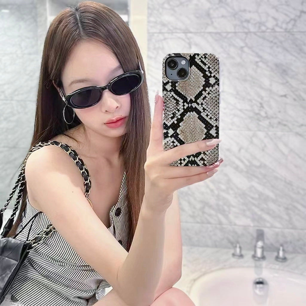 Model holding Printed Python Case. High-fashion snake motif on a flexible and resilient silicone frame.