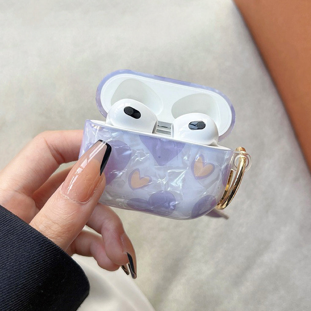 Model holding Purple Heart Shaped AirPods Case Cover, great for daily protection and travel.