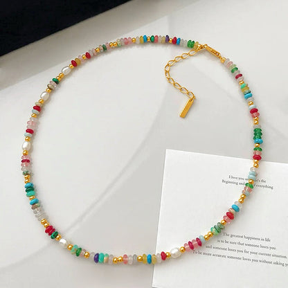 Close-up of Rainbow beaded necklace featuring a colorful bead arrangement.
