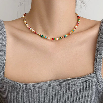 Model wearing a Rainbow Beads Necklace, ideal for layering.