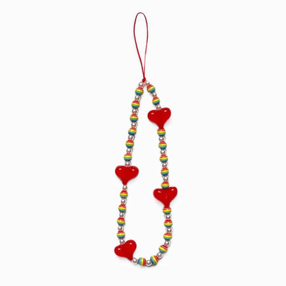 Front view of Rainbow Heart Phone Charm with red hearts and rainbow-striped beads.