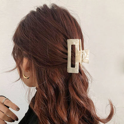 Model wearing Rectangle Hair Claw in white, ideal for quick updos and ponytails.
