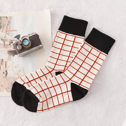 Folded view of Red Checker Socks, ideal for workouts and commuting.
