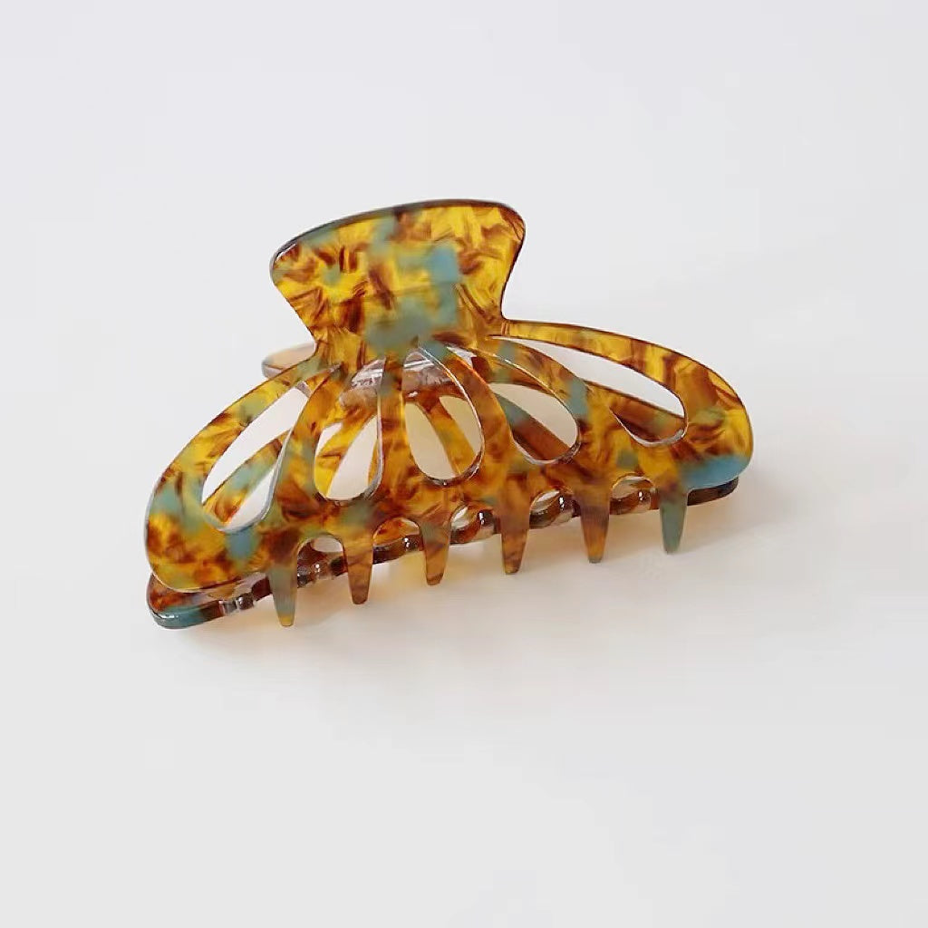 Flat lay of Retro Hair Claw in latern shape , great for everyday styling and gifting.