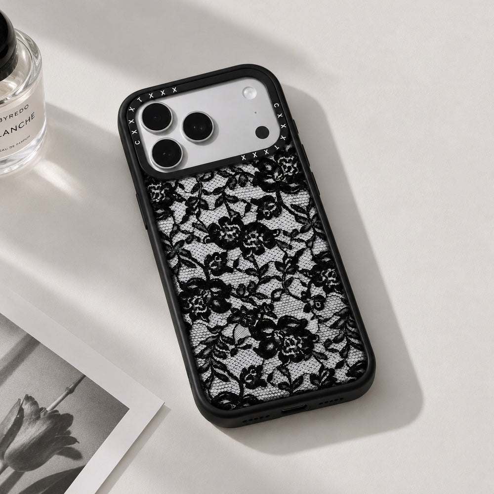Close-up angle of the rose lace clear phone case resting on a white surface showing camera bumper cutouts.