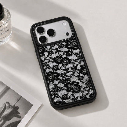 Close-up angle of the rose lace clear phone case resting on a white surface showing camera bumper cutouts.