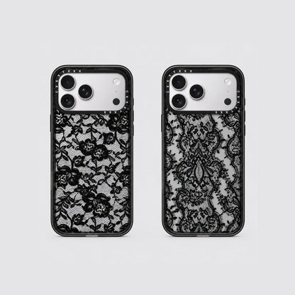 Flatlay view of two retro lace phone cases showing scroll lace and floral lace patterns on clear back panels.