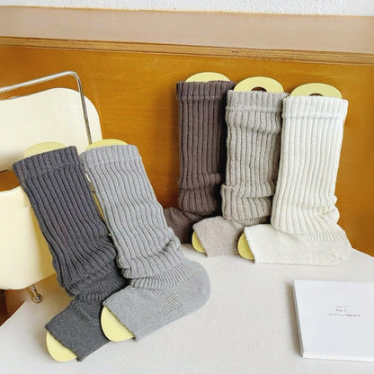 Angled view of 5 pairs of Ribbed Knit Leg Warmers shown together.