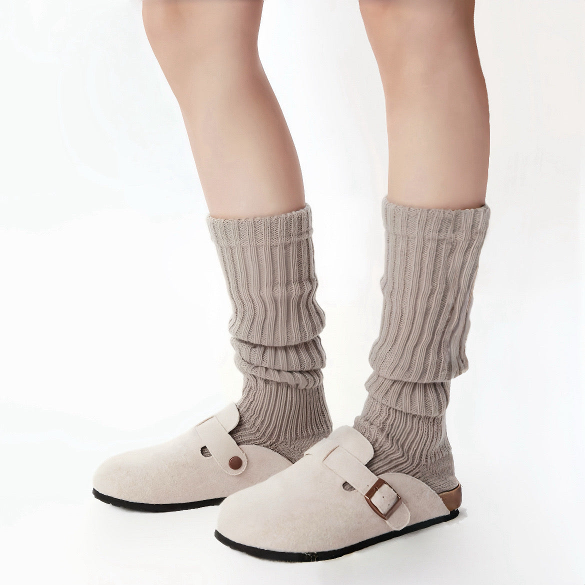 Model wearing a pair of khaki  Ribbed Knit Leg Warmers, easy for travel days and daily comfort.
