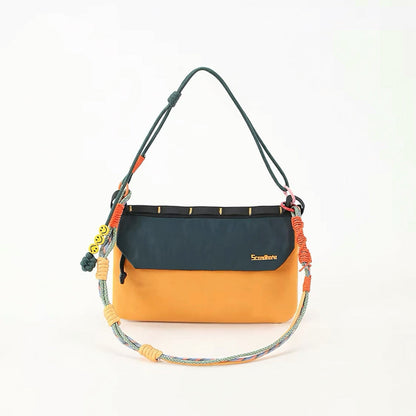Front view of Yellow and green Rope Play bag styled as a shoulder purse.