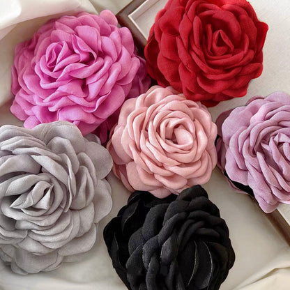 Flat lay of 6 colors of Rose Reveries Hair Claw, easy for vacation styling.