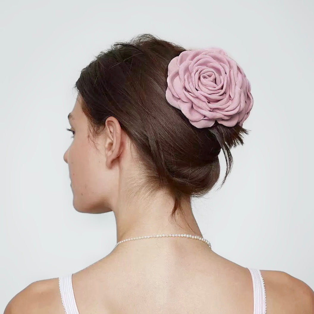 Model wearing a dusty pink Rose Reveries Hair Claw, ideal for everyday outfits and romantic looks.