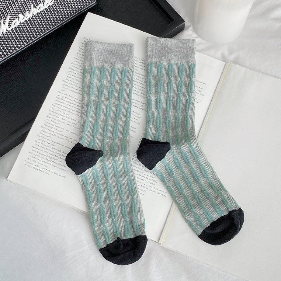 Angled view of Sculptured Ripple Knitted Socks in gray, great for daily wear and lounging.