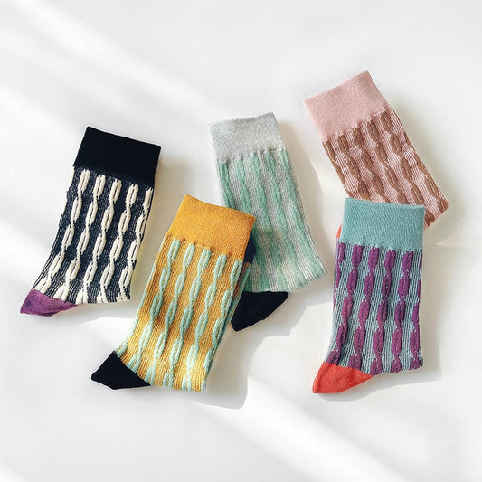 Front view of Five pairs of Sculptured Ripple Knitted Socks in assorted colors: black, yellow, grey, green and pink.