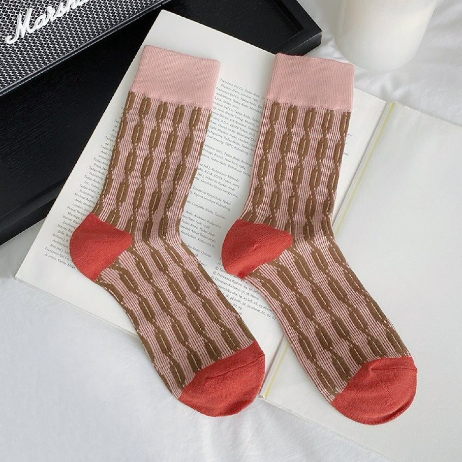 Close-up of Sculptured Ripple Knitted Socks in pink, ideal for workouts and commuting.