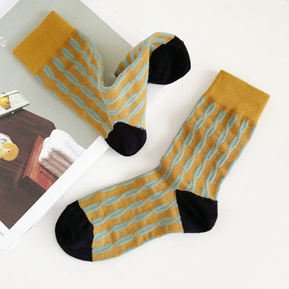 Angled view of Cotton Sculptured Ripple Knitted Socks in mustard yellow .