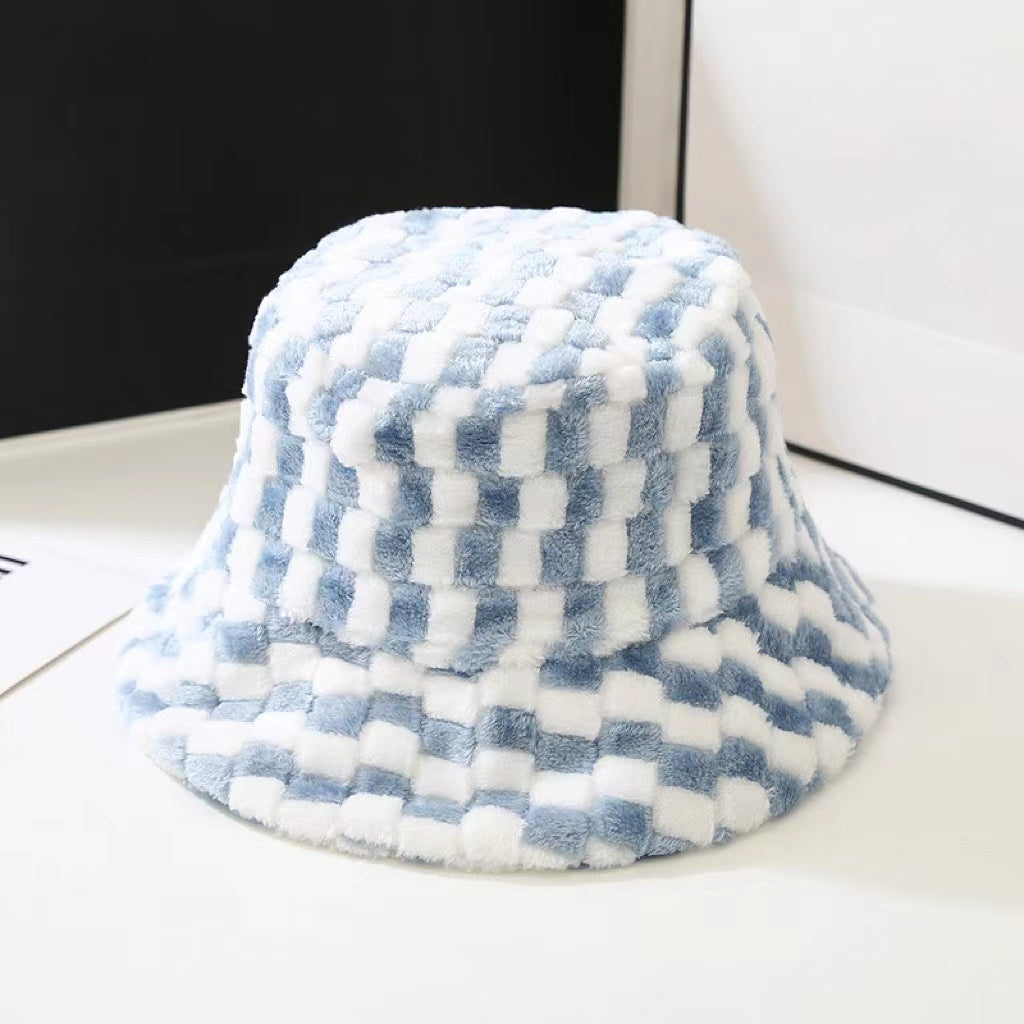 Front view of Sherpa Checkered Bucket Hat in blue, features bold checkered patterns in soft-touch winter fabric.