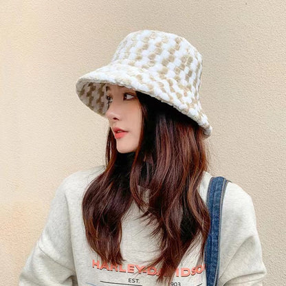 Model wearing Sherpa Checkered Bucket Hat in khaki, showcasing high-density fleece for maximum comfort.