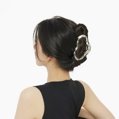 Model wearing a Silver Cloud hair claw, ideal for quick updos and ponytails.