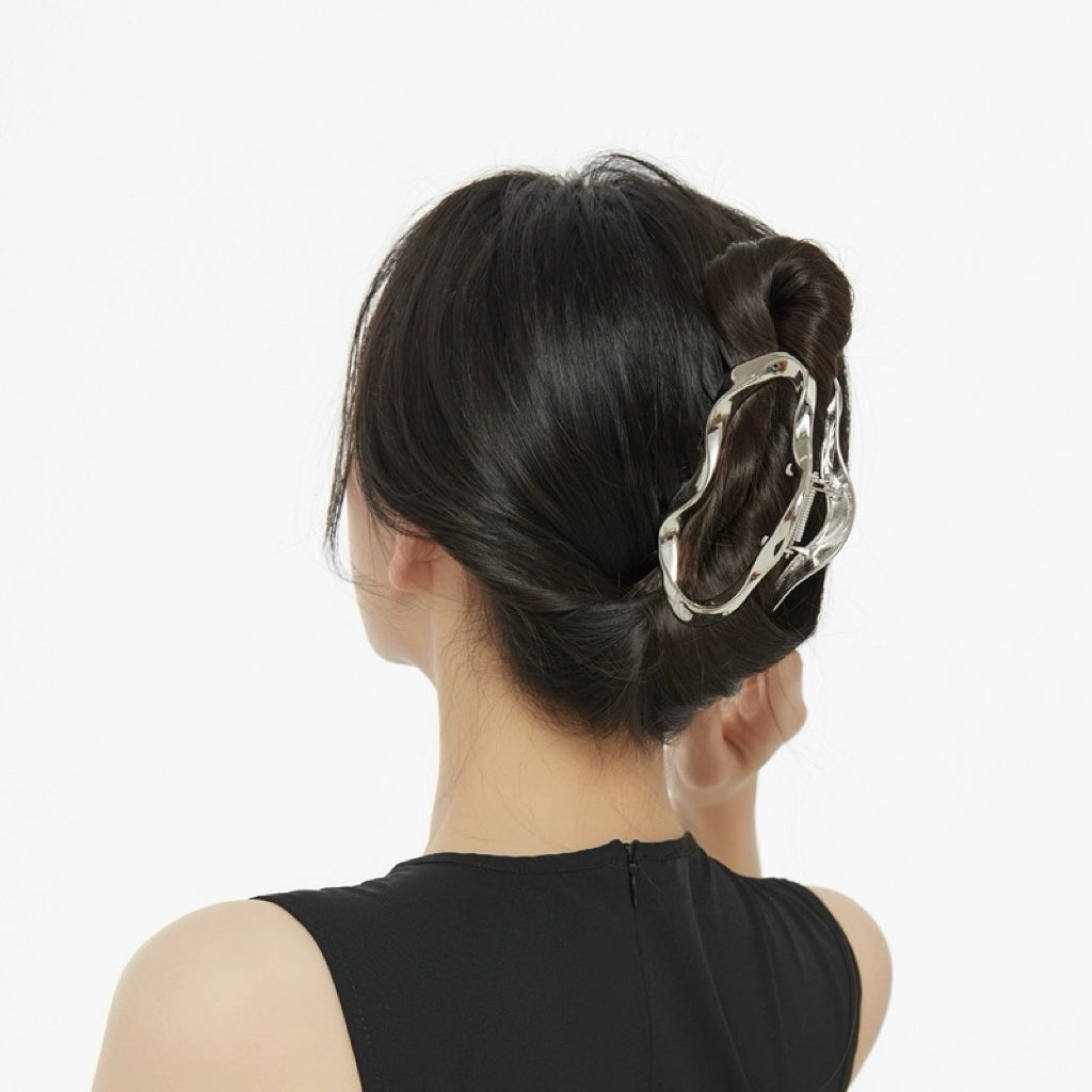 Model wearing a Silver Cloud hair claw, easy for workdays and special occasions.